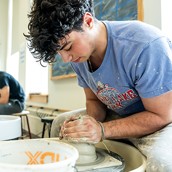 A student in pottery class. Links to Closely Held Business Stock A student in pottery class. Links to Closely Held Business Stock