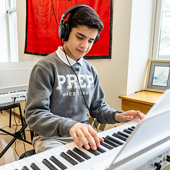 A student practicing on the electric piano. Links to Tangible Personal Property A student practicing on the electric piano. Links to Tangible Personal Property