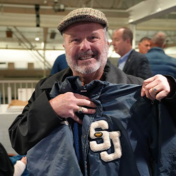 Alumni holding letterman jacket. Links to Gifts That Protect Your Assets Alumni holding letterman jacket. Links to Gifts That Protect Your Assets